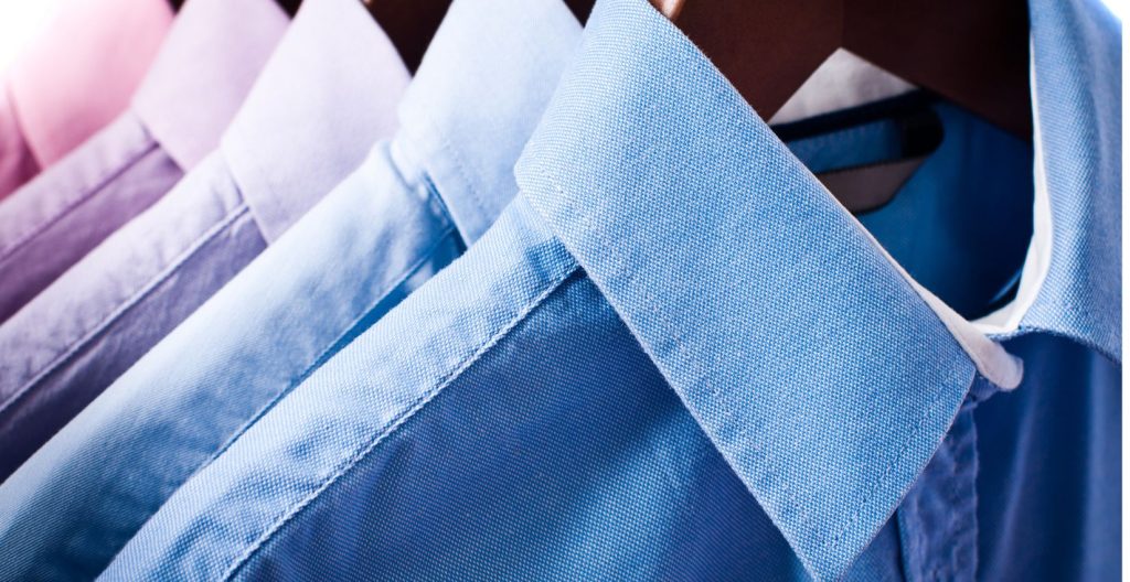 Clean button shirts hanging after laundry and press